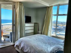 Bedroom with doors openimg onto the balcony