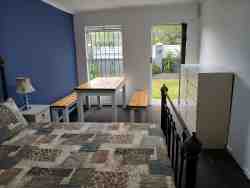 Bedroom with Double bed size and dining table and fridge