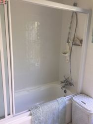 Bath with shower.