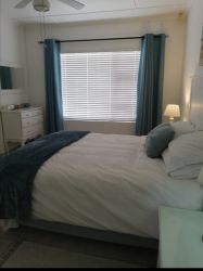 Main bedroom with queen bed and bathroom en suite