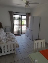 Dining room leads out on to braai outside 