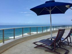 Huge wraparound balcony with views up uninterrupted views up and down the coastline.