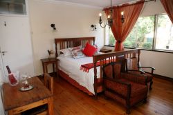 Our deluxe king room has an en-suite bathroom with bath and shower.