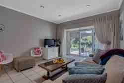 Rainier's Sitting room leads out onto its own shaded patio overlooking the delightful garden