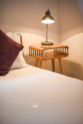 Patio Self-Catering Suite, crisp white linen.  Enjoy a peaceful and luxurious sleep