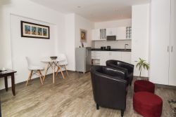 Patio Self-Catering Suite, fully equipped kitchenette, sitting area and dining area