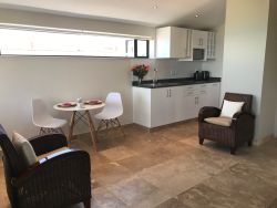 Sea View Deluxe Self-Catering Suite fully equipped Kitchenette, dining area and chairs