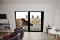 Patio Self-Catering Suite, lounge, dining area, glass sliding door, coffee machine, DSTV, television