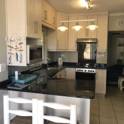 Fully equipped kitchen with microwave, dishwasher, and air-fryer