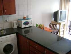 Kitchen overlooking lounge