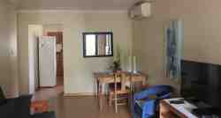 Spacious living area towards kitchen