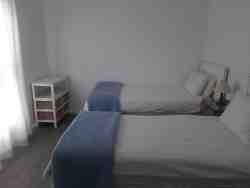 Second bedroom wit 2 single beds on suit