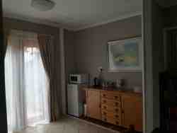Ilala full kitchenette with table and chairs