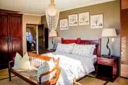 Lodge Bedroom with river view and ensuite bathroom with shower