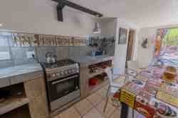 Sky Villa - Spacious fully equipped kitchen with an oven, stove, and fridge/freezer.
