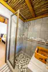 Sky Villa - Bedroom 2. Ensuite - Shower, toilet, and basin.