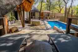 Sky Villa - Lay on the sun loungers on the patio with a scenic view of the pool and bush. Reading a good book, chatting with friends, or just relaxing and enjoying nature!