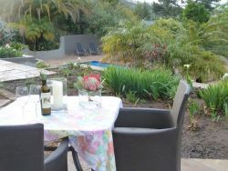 Terrace of Apartment 1 with direct access to garden and pool.