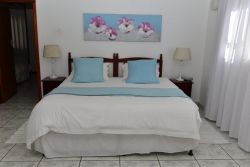 Family room:
Sleeps 4 persons.
This room type has a queen size bed and two single beds.  
En-suite bathroom 