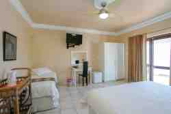 Bedroom 4  with king size bed that can be made as 2 single beds on request, plus an additional single bed.
