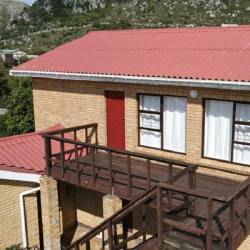 Protea Flat, a 1st floor apartment with wooden balcony.