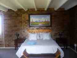 Queen bed, bar fridge and TV