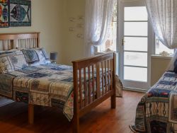 Family room: sleeps 5  double bed + single bed Interleading room 
+2 single beds, fan, tv.
bathroom/shower- bath in both units 
kitchenette: microwave, kettle, fridge,coffee tea station. separate entrance to unit