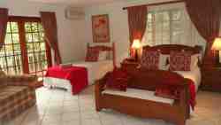 Butterfly Room - 
Family Room sleeps 4 to 5 people.  double bed, three-quarter bed, sleeper couch (Sofa) for children 1-8 years old.  Can arrange an extra bed in the room.