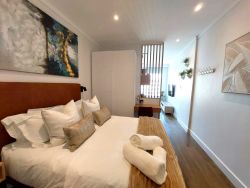 Bedroom, cupboards and seating area view