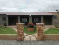 front view of the chalets with separate braai units and porch  