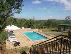 Swimming pool with loungers and umbrellas 