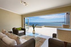 The 2nd lounge flows onto a generous sun deck where you can suntan or braai (barbecue) while overlooking the sea.
