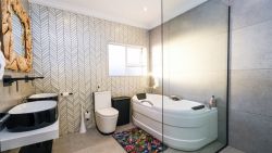 Main bedroom ensuite bathroom with bath and walk in shower