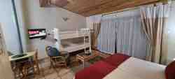 Open Plan bachelor cottage with twin single beds  & bunkbed in same room, kitchenette & en-suite bathroom with shower