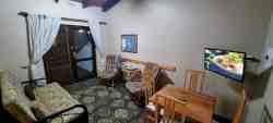 Multi-room cottage - living area with double sleeper couch