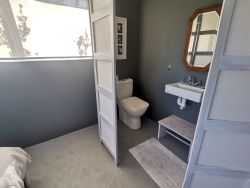 Separate screened-in toilet in bedroom