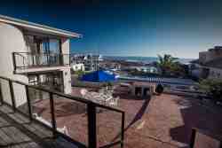Large patio with ocean views & barbecue area