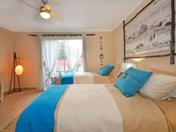 The Guinea Fowl room with 2 single beds or else the beds can be converted to a king size bed. The room also has a balcony and en suite bathroom with shower.