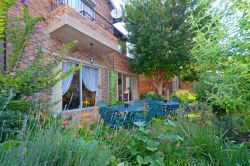 Another view of the outside seating area where guests can either have breakfast, relax or work.