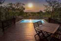 Sunset behind the mountains from the deck and pool