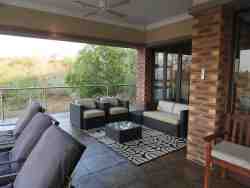 A cosy seating nook on the expansive deck, overlooking the Crocodile River
