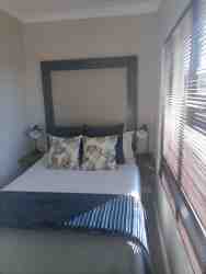 Bedroom, with double bed. The bedroom is +- 2m wide.