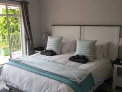 The king bedroom can be made up as two singles.  The bedrooms are all light and bright and tastefully decorated with magnificent views. 