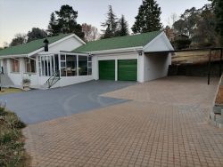 The house has a double carport for guests' convenience 