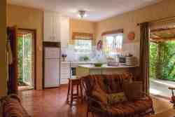 Kitchen opening up to veranda