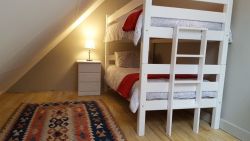 Loft room has a bunk bed and a double sleeper couch, perfect for 4 kids sharing.