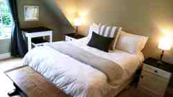 2nd bedroom has a queen size bed with electric blankets, ceiling fan and hairdryer. It overlooks the garden.
