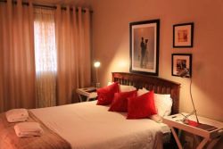 room nr 6 with a queen size bed . 