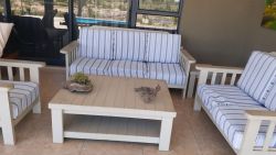 On the patio is a conversation corner.