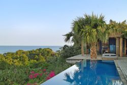 The Pool of the Artist's Retreat Villa with reflections on the calm water is one of the designer's master pieces.